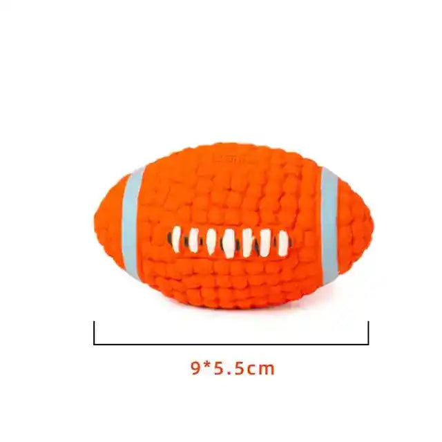 Bright orange squeaky dog toy shaped like a football, featuring a textured surface and white accents, measuring 9x5.5 cm.