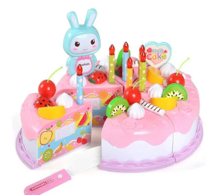 Pink cake toy set for kids with colorful fruit toppings, candles, and a bunny figure to inspire creative play.