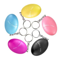 Set of colorful keychain emergency alarms in yellow, blue, pink, purple, and black, featuring a compact and portable design.