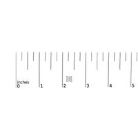 Size comparison of 14K white gold princess cut diamond stud earrings against a ruler, measuring approximately 2.75 mm in width.