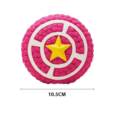 Pink round squeaky dog toy with a yellow star design, 10.5cm in size. Durable and fun pet toy from Shop Name.