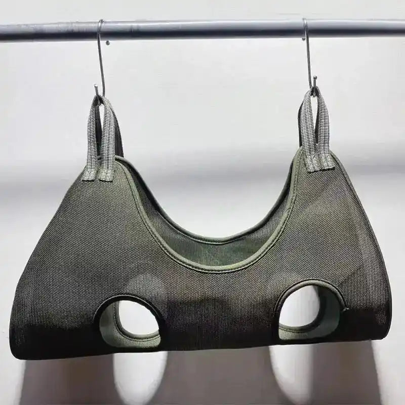Gray pet hammock hanging on a rod, showcasing its durable fabric and ergonomic design for pet grooming. Suitable for cats and small animals.