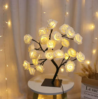 Romantic Rose Tree Lamp featuring soft yellow LED lights on a white table, ideal for creating a cozy and romantic atmosphere.