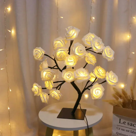 Romantic Rose Tree Lamp featuring soft yellow LED lights on a white table, ideal for creating a cozy and romantic atmosphere.