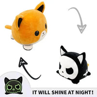 Double-sided plush toy with a glowing orange and black cat design, reversible expressions. Unique and fun from Shop Name.