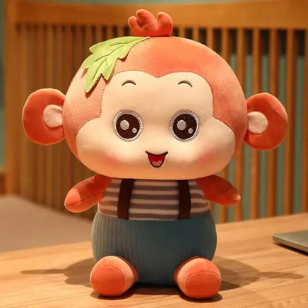 Adorable sitting monkey plush toy with a leaf detail on its head, striped shirt, and blue overalls, perfect for all ages.