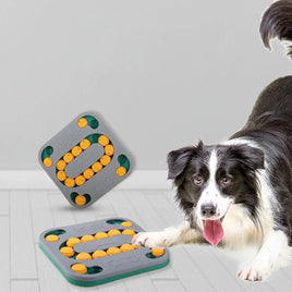 Border Collie playing with a gray and yellow interactive dog puzzle toy, ideal for mental stimulation and treat rewards.