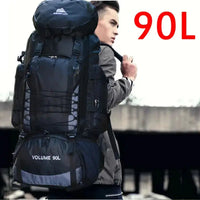 Man carrying a black 90L outdoor travel backpack with ergonomic straps, ideal for trekking and outdoor expeditions.