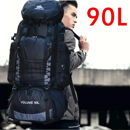 Man carrying a black 90L outdoor travel backpack with ergonomic straps, ideal for trekking and outdoor expeditions.