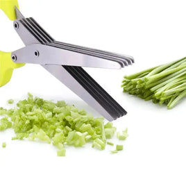 Multifunctional multi-layer green onion scissors with stainless steel blades cutting green onions into fine pieces, ideal for kitchen use.