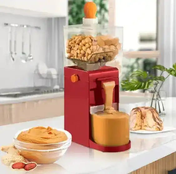Electric Peanut Butter Grinder in a modern kitchen, dispensing fresh peanut butter into a container, surrounded by bread and 