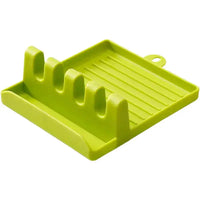 Green spatula drain rack gadget with four slots and a drip tray, ideal for keeping utensils clean and organized.