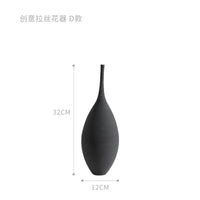 Black Jingdezhen modern minimalist handmade vase with a teardrop shape, 32cm tall and 12cm wide, displayed with dimensions.