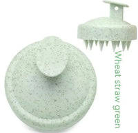 Green wheat straw soft rubber shampoo brush with soft bristles and ergonomic handle for scalp massage.