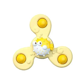 Yellow baby spin toy with a pufferfish design and three rounded yellow spinning points, ideal for babies' playtime and bath activities.