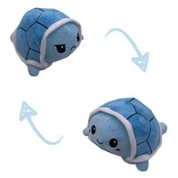 Blue turtle double-sided plush toy with reversible angry and happy expressions. Soft and adorable from Shop Name.