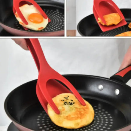 Red 2-in-1 kitchen gadget flipping pancakes and eggs in a frying pan, demonstrating its multifunctional cooking capabilities.