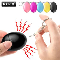 Black keychain emergency alarm being activated, emitting loud sound waves for personal safety and emergency situations.