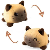 Double-sided plush toy featuring a cat design with reversible expressions, one angry and one happy. Available at Shop Name.