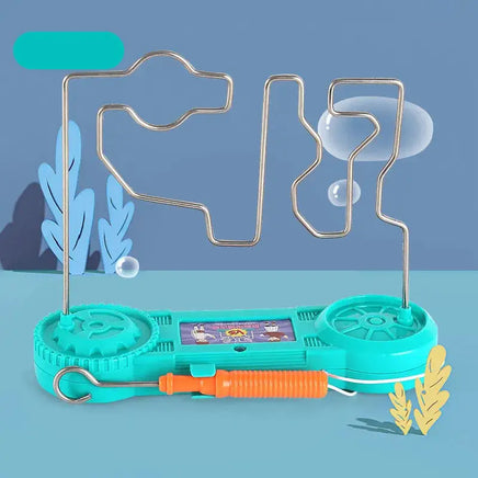 Teal electric bump maze toy with orange wand, set against a playful background with decorative elements.