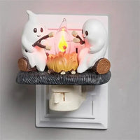 Wall-mounted Halloween Ghost Campfire Night Light with LED flame and ghost characters, adding spooky charm to Halloween night lighting.