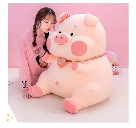 Charming soft pig toy with pink accents, posed with a woman in a pink sweater, ideal for cuddles and playful moments.