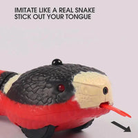 Close-up of the electronic snake toy's head, showcasing its lifelike texture, LED eyes, and tongue movement for realistic interaction.