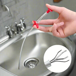 60CM sewer dredger spring pipe tool with red handle used to remove clogs in a kitchen sink, featuring a claw mechanism for effective cleaning.