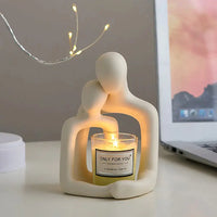 Nordic couple statue holding a candle, designed for cozy and elegant home decoration.