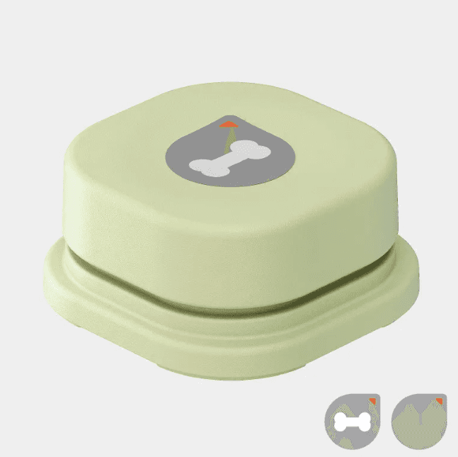 Close-up of a single green sound button with a dog bone icon, soft silicone surface, designed for pet communication and training.