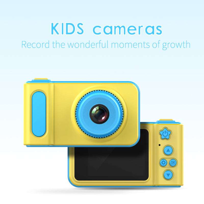 Child holding colorful camera outdoors