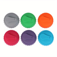 Top view of six silicone can lids in assorted colors with flip-top seals. Perfect for keeping drinks fresh and portable.