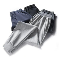 Crossfit Track Sweatpants in assorted colors including black, navy, gray, and light gray, showcasing a stylish and comfortable design for gym and casual wear.