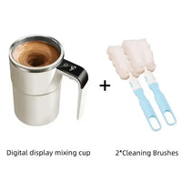 Self-Stirring Electric Coffee Mug with digital display, accompanied by two cleaning brushes for easy maintenance.