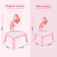 Size comparison of the Kids Mini Art Table Set in regular and mini versions, showcasing pink giraffe projector tables with dimensions.