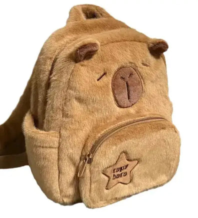 Capybara Plush Little Backpack with a front pocket, star patch detail, and soft plush material, perfect for kids or casual use.