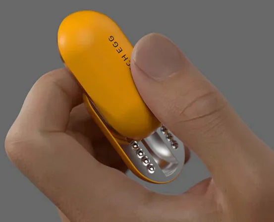 Bright yellow mechanical push card coin stress relief toy with metal ball bearings, handheld size for anxiety management and focus