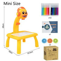 Mini-sized Kids Art Table Set with a yellow duck projector, including markers, stencil discs, an art booklet, and packaging.