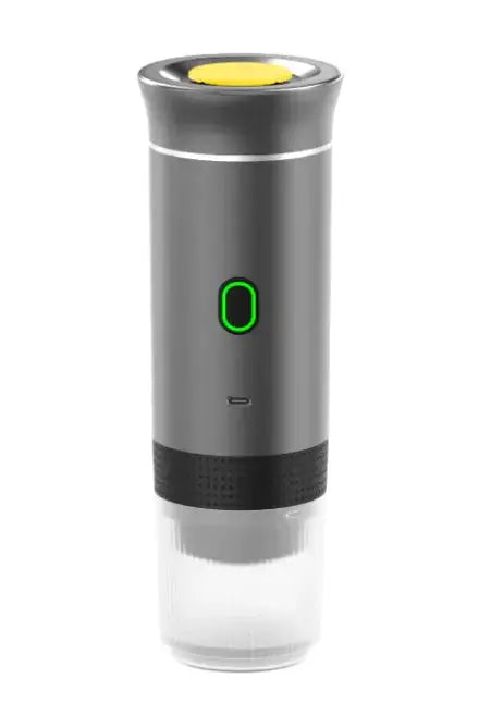 Gray portable capsule coffee machine with a modern design, green power indicator, and detachable water tank for easy use.