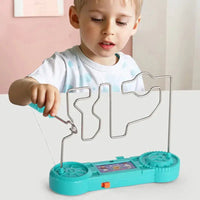 Child playing with the teal electric bump maze toy, demonstrating its interactive and engaging design.