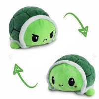 Green turtle double-sided plush toy with reversible angry and happy expressions. Soft and fun from Shop Name.