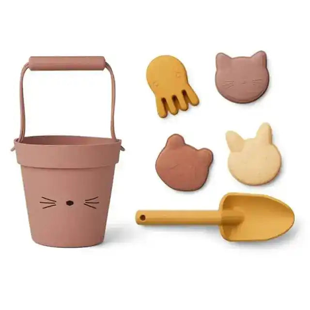 Beige cat-themed beach toy set with a bucket, shovel, and animal-shaped sand molds, ideal for children's summer fun at the beach.