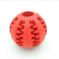 Red interactive rubber slow feeder dog ball featuring ridges for treat dispensing, designed for engaging play and chewing.