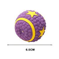 Purple squeaky dog toy ball with yellow star accents, measuring 6.5 cm, designed for interactive pet play and entertainment.