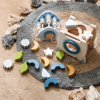 Educational rocket toy with colorful shapes on a textured rug, encouraging imaginative play and cognitive development.