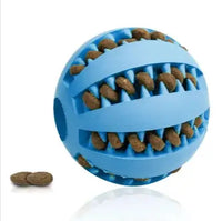 Blue interactive rubber slow feeder dog ball filled with kibble, showcasing its treat-dispensing functionality for dogs.