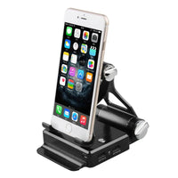 Black podium style stand holding a smartphone, showcasing its adjustable angles, USB ports, and extended battery.