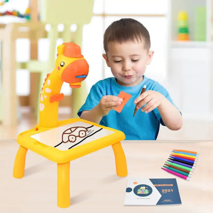 Child using the Kids Mini Art Table Set with a yellow giraffe projector, drawing tools, and colorful markers for creative activities.