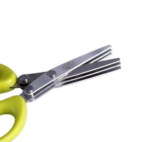 Close-up of multifunctional green onion scissors with stainless steel blades and green handles, highlighting its durable design.