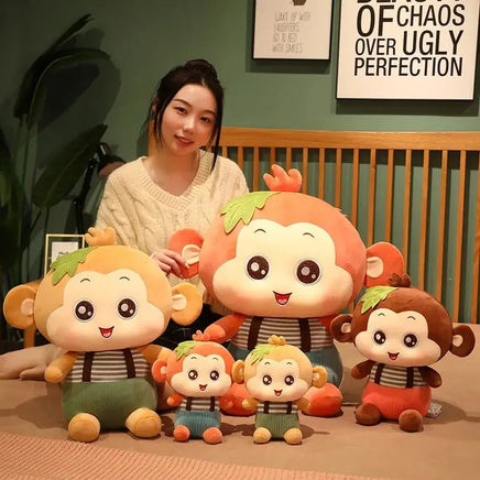 Adorable Sitting Monkey Plush Toys in various sizes displayed with a woman, featuring vibrant colors and cute facial expressions.